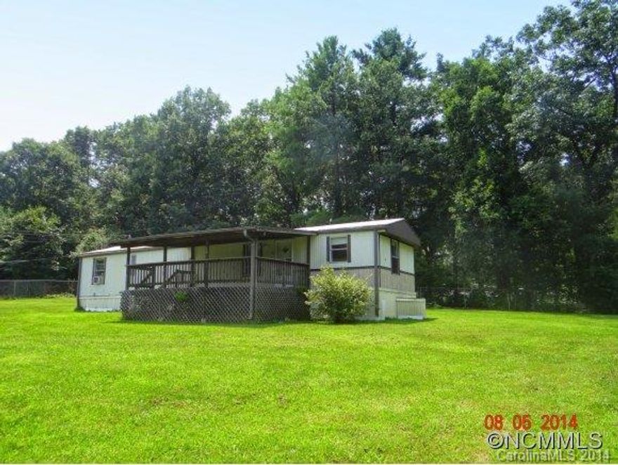 This well maintained home has a great rental history - perfect for investors. Freshly painted and move-in ready. Huge covered porch. Large fenced lot may have potential for another mobile home. Great location, convenient to South Asheville shopping, schools, dining and more.  All appliances convey. Home warranty. Square footage per tax records.