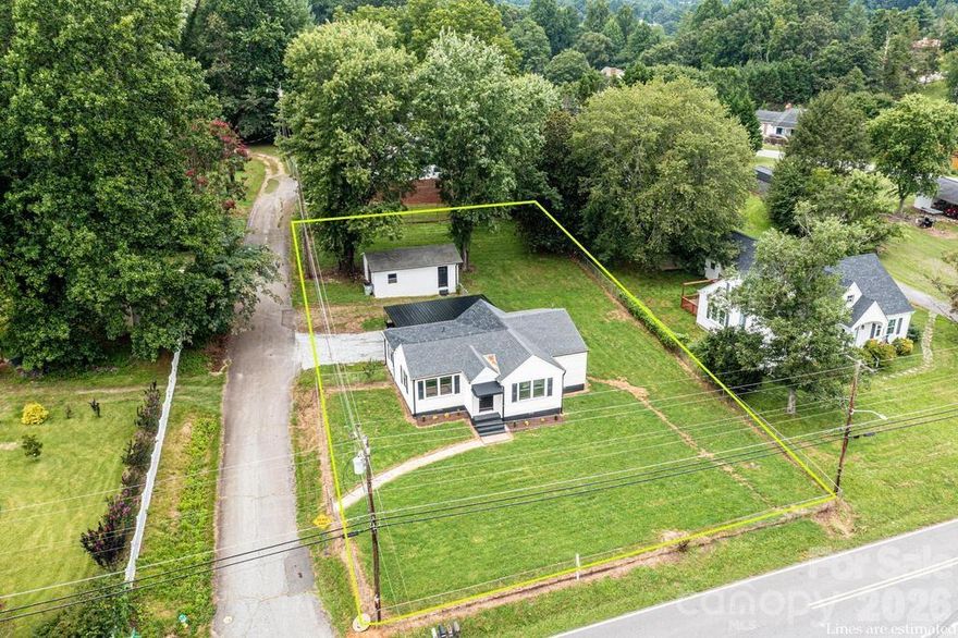 Only a few minutes from the Lenoir Aquatic and Fitness Center and the Lenoir Greenway, this home has so much to offer!   Welcome to the cutest home in Lower Creek!  Everything about this home is move-in ready!  With new floors, windows, paint, light fixtures, bathroom, kitchen, doors, ceiling fans, gutters, outside lighting, composite deck - this home has been lovingly made over & is waiting for you to call it home.  Beautiful new awning welcomes guest at the front door & upon entry you will appreciate the arched doorways reminiscent of the era in which the home was built!  Classic charm meeting modern upgrades! Entire home has LVP flooring unifying the living room w/ the dining room & into the bedrooms!  3 Bedrooms have nice closet space & bright new windows allowing natural lighting throughout!   Fenced in yard!  Carport for parking!  Even a detached garage ready for a man cave, an art studio, a work out area - whatever you can imagine!  Lenoir, located at the foothills of the Appalachian Mountains is a perfect place to live, work & play!  The Lower Creek area of Lenoir is a highly sought after area!