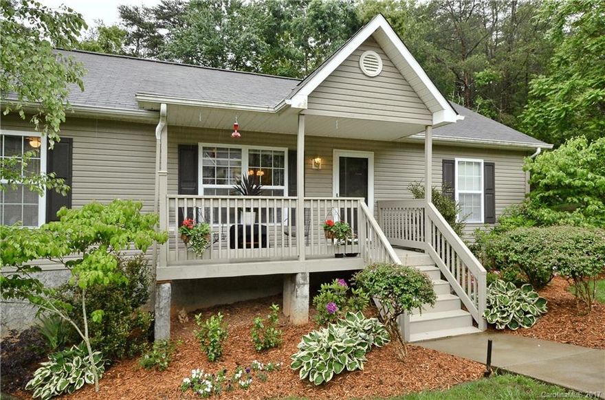 Storybook cottage in a beautiful, convenient cul-de-sac super close to downtown Asheville in desirable Haw Creek. Rocking chair front porch and private back deck with woods all around, yard with beautiful low maintenance landscaping. Lower level has so many possibilities for being finished, workshop possible, home office area, playroom or more. Creek and woods in the common spaces.  Super low maintenance home. Will not last long at this price in this location.  Owner is a real estate broker.