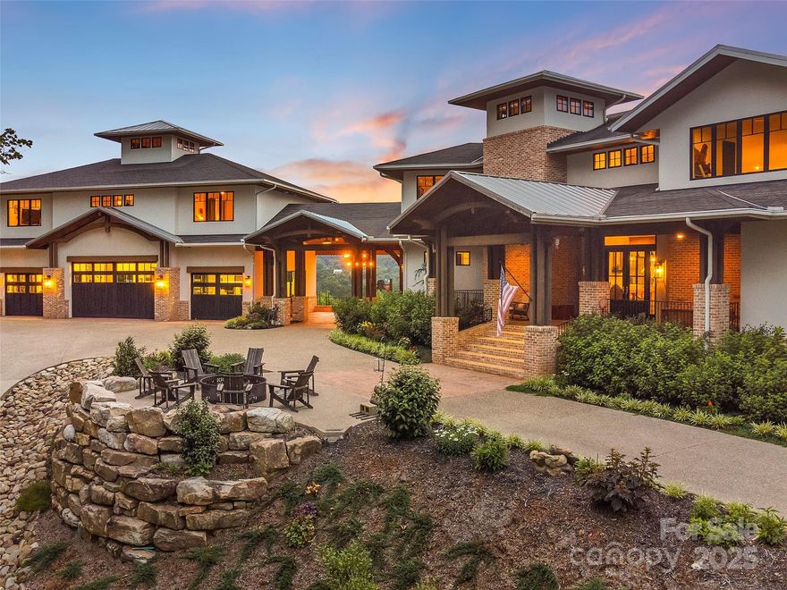 Absolutely spectacular custom mountain estate with magnificent views of the Blue Ridge Parkway. Located in Mills River near South Asheville, approximately 10 minutes to the Asheville Regional Airport, this private 36.79± acre property offers expansive open living areas, hardwood floors, and a gourmet kitchen with top-of-the-line appliances. Features include three fireplaces, a spacious primary suite, expansive outdoor areas, and four-car garage with guest quarters above. Enjoy the stunning covered porch with fireplace and long-range mountain views. The property also offers a pasture and open areas for gardening, a paved driveway, and a gated entrance. A rare and exceptional mountain estate in Western North Carolina.