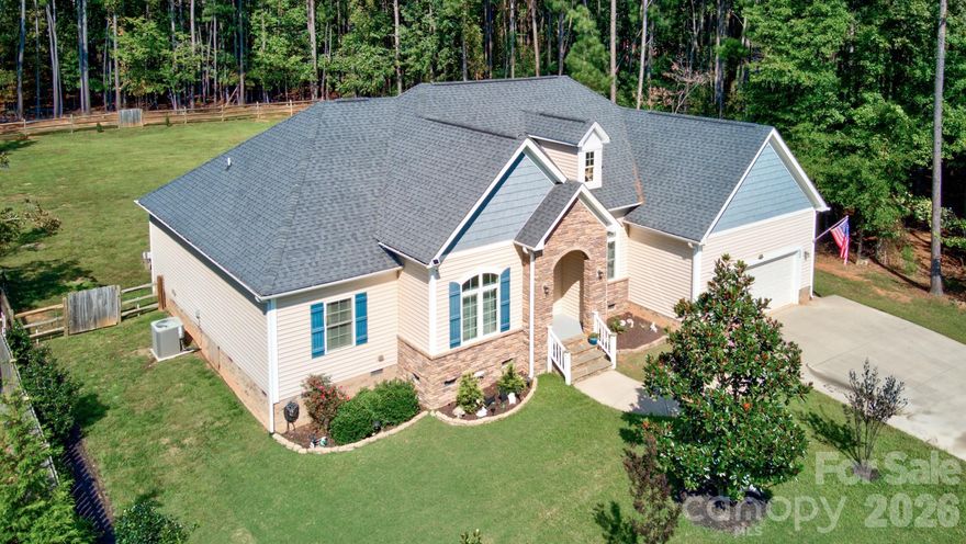 Discover this beautifully designed 4 bedroom ranch home where comfort, style, and lifestyle come together seamlessly—all set on a private, water-view lot in one of the area’s most desirable locations. Inside, the home opens to a stunning eat-in kitchen that serves as the heart of the home—perfect for everything from quiet morning coffee to hosting gatherings with friends and family. The open, inviting layout creates a natural flow that makes everyday living and entertaining feel effortless. A dedicated home office with a picture window offers the ideal space for remote work, creative pursuits, or simply a quiet place to unwind while enjoying peaceful outdoor views. The spacious primary suite is designed as a true retreat, featuring oversized windows that fill the room with natural light and create a serene, relaxing atmosphere at the end of the day. Step outside and experience the lifestyle this property offers. The expansive rear deck with a shaded awning is perfect for outdoor dining, entertaining, or simply enjoying the tranquil setting. The fenced-in backyard provides plenty of space for pets, play, or gardening, while a large storage shed offers added convenience for tools, hobbies, or recreational gear. For those who love life on the water, this location is hard to beat—just 10 minutes to Morning Star Marina and Stumpy Creek Public Boat Access, making it easy to enjoy boating and lake days whenever you choose. Offering the perfect balance of privacy, convenience, and lifestyle, this home invites you to slow down, spread out, and truly enjoy where you live.