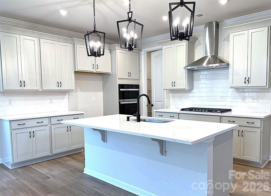 FINAL OPPORTUNITY - Welcome to this beautiful new construction home featuring a highly sought-after primary suite on the main level, located in the boutique community of Roseshire Chase, an intimate neighborhood of just 36 homes surrounded by a natural buffer of mature trees. Ideally positioned between Exit 23 (Gilead Road) and Exit 25 (Sam Furr Road) in Huntersville, this location offers the perfect balance of peaceful living with quick access to everyday conveniences. Just minutes away, residents can enjoy shopping, dining, and entertainment at Birkdale Village, outdoor recreation at Lake Norman, and additional retail and dining options at Rosedale Village. Outdoor enthusiasts will appreciate the short walk to Torrence Creek Greenway, providing direct access to miles of greenway, nature, and urban trails connecting Huntersville, Cornelius, and Davidson. It's the perfect way to enjoy the natural beauty and outdoor lifestyle of the Lake Norman area. Despite its peaceful setting, the home is conveniently located just 15 miles from Uptown Charlotte, making commuting or enjoying the city’s dining, entertainment, and business district quick and convenient. This home offers a rare combination of new construction, main-level living, a boutique community, and exceptional access to Lake Norman and Charlotte amenities. – Finance incentives available.