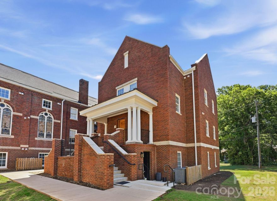 A rare opportunity to own newly constructed luxury living within one of Charlotte's most distinctive adaptive reuse communities. Located within The Arches in the heart of Wesley Heights, this 3-story townhome-style condo blends modern design with the architectural presence and history of the neighboring restored 1920 church. Built in 2023 as part of the community's thoughtfully integrated expansion, this residence offers 2 bedrooms, 2.5 baths, approximately 1,337 square feet, and a private rooftop terrace designed for elevated urban living.

The open-concept main level features abundant natural light, a spacious living area, and a modern kitchen complete with quartz countertops, stainless steel appliances, custom cabinetry, tile backsplash, and a large island ideal for both everyday living and entertaining. Upstairs, both bedrooms offer privacy and functionality with well-appointed baths and clean, modern finishes throughout. The rooftop terrace provides an additional outdoor living space perfect for relaxing, entertaining, or enjoying skyline views and evening sunsets.