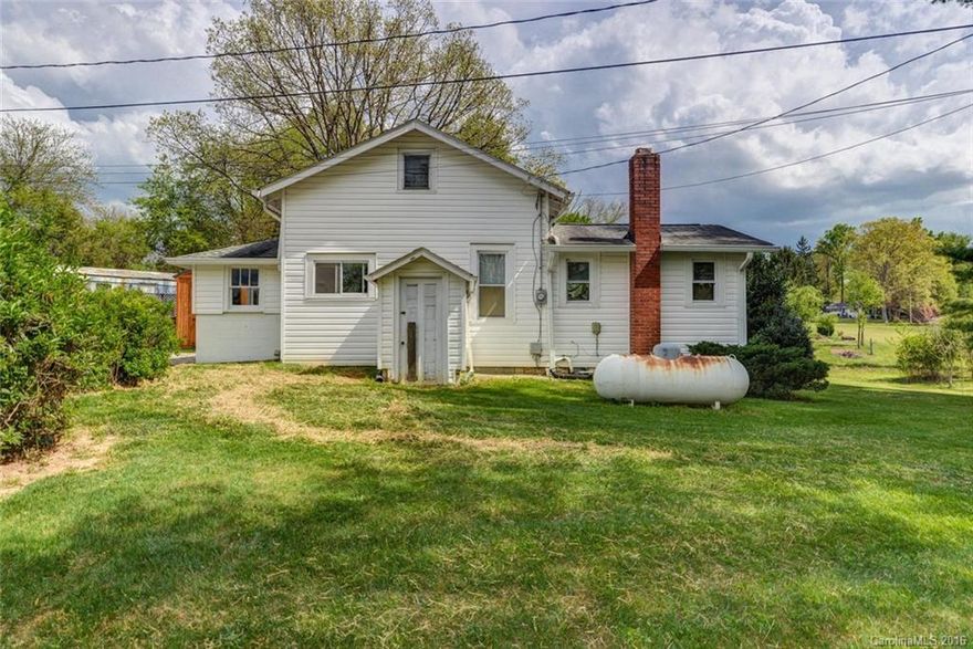 Great long range views and two homes on two lots. Lot 1 contains a 1940's home with 1,001 SF and two pads for manufactured homes on 1.309 acres. Lot 2 contains a doublewide manufactured home with 1,394 SF built in 2002 which currently rents month to month for $1,000/month. The site has been divided and the plat recorded and it is attached to the MLS listing. Amazing income potential for the investor or for an end user who would like some supplemental rental income. Public water.