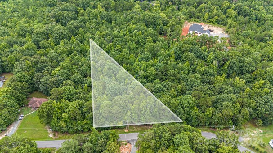 Welcome to a great place to build your new home!  This gently sloping, wooded lot has several different building options on just over 1.5 acres.  County water is  available at the street and the seller has had the property perced for a 4 bedroom home standard septic system. Natural gas is also available down the road.   Seller has a set of home plans available for purchase as well!  Don't miss this one!