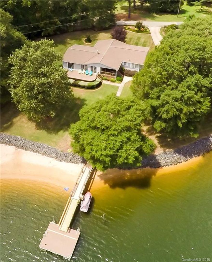 Wonderful Waterfront home on beautifully landscaped, level lot w/deep water & 200+ft of shoreline. Fabulous covered porch, sundeck are perfect spots for outdoor entertaining or just to relax & take in the outstanding views. Sandy beach, fully rip-rapped, new dock. Home has new stainless appliances in large kitchen w/granite countertops, island, breakfast area. Family Room & Master Bedroom lead out to huge deck.