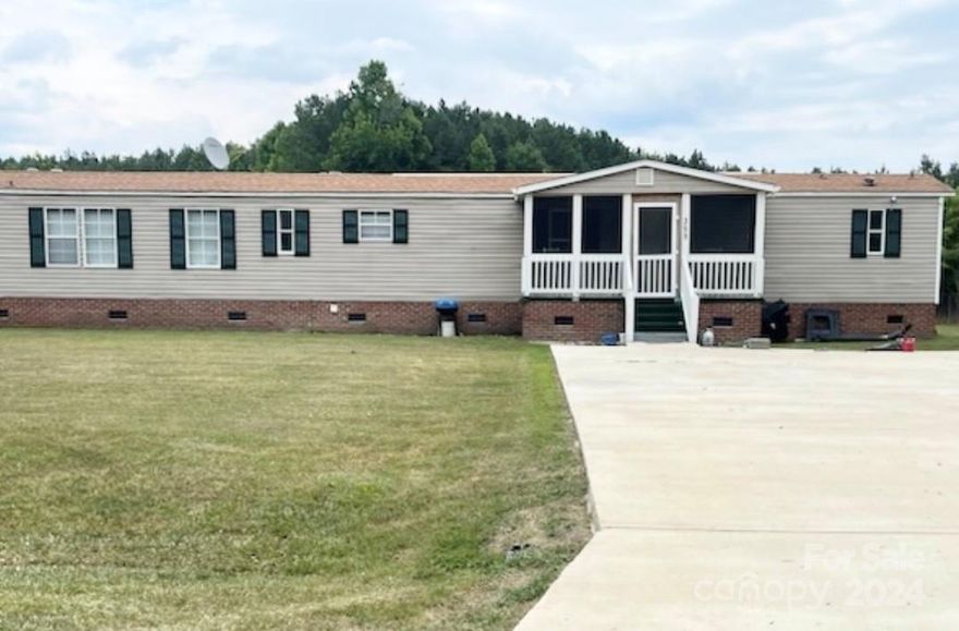 Attention investors or home buyer who loves a fixer-upper and can give a little TLC, this 4-bedroom, 3 bathroom single-wide manufactured home with septic on a permanent foundation is surrounded by open space on a generous .63-acre fenced lot, offering country living with the convenience of city amenities a short drive away. The open split bedroom floor plan provides both privacy and a spacious feel. The Family Room, located adjacent to the kitchen and dining was converted into a second primary suite "bathroom unpermitted"  and features a huge soaking tub, separate shower and walk in closet. 

Don't miss out on the chance to make this delightful property your own. Schedule a viewing today with your preferred agent and discover the joys of country living. **Property is AS-IS**