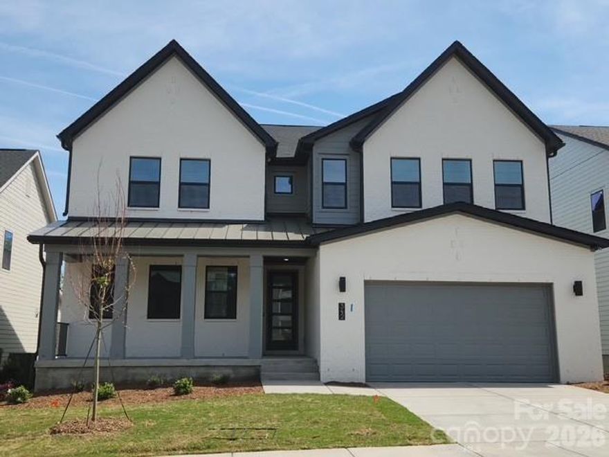 Homesite 30 showcases the highly desirable Logan floorplan with exceptional design details throughout. The impressive two-story great room features a fireplace and a 12’ rolling wall that opens to an outdoor living space, offering seamless indoor-outdoor connection. A main-level guest suite and a finished basement with a full bedroom and bath provide outstanding flexibility for guests or multigenerational living. The kitchen is thoughtfully designed with gas appliances, abundant cabinetry, and upgraded finishes. Additional highlights include French doors at the flex space, enhanced trim and flooring details, a loft with dedicated workspace, dual vanities in all full baths, a walk-in laundry with optional sink, and a large drop zone at the garage entry. The private primary suite offers a covered deck and spa-inspired bath with a freestanding tub—delivering comfort, functionality, and elevated style in one remarkable home. Located in the desirable Windell Woods community, this home combines functional design with contemporary appeal in a serene Tega Cay and Lake Wylie setting. Schedule a tour today!