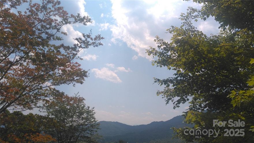 Priced to sell with picturesque long range views for miles and the soothing sound of the waterfall on Pond Branch Creek below! Build your mountain getaway, vacation rental home or permanent residence on this easily accessible lot in a gated community. Paved roads and located just a short ways inside the gate. Just 10 minutes from Linville Falls, Blue Ridge Parkway, Linville Falls Winery and 40 minutes to Boone, Banner Elk and Asheville. Call today for your showing!