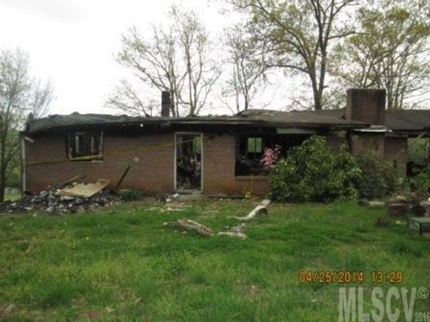 Being sold as land only. Over half acre lot.  Town of Sawmills water.  Property has a burned out house on it that will not be removed.