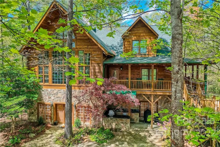 One-of-a-kind waterview property offers plenty of room & peaceful living. Lovely outdoor living area features patio with waterfall pond, firepit, & open-air kitchen area which includes sink, grill, frig, granite counter workspace for outdoor gatherings. The wrap-around porch is perfect for quiet morning coffee. Great room with soaring ceiling, a wall of windows to enjoy the view, gorgeous see-thru stone fireplace for those cozy winter evenings. Kitchen is large with lots of granite counter workspace, great flow for entertaining; access to wrap porch. Huge dining space, large secondary bedrooms with jack & jill bath on main level. Upstairs features flex space loft area with beautiful views, huge primary suite with jetted tub, dual sink vanity, large shower in primary bath. Downstairs play space has bar area & fireplace in family room with access to outdoor living. Garage space galore! Don't forget guest cottage/flex space for long-term guests above garage/workshop space. Welcome home!