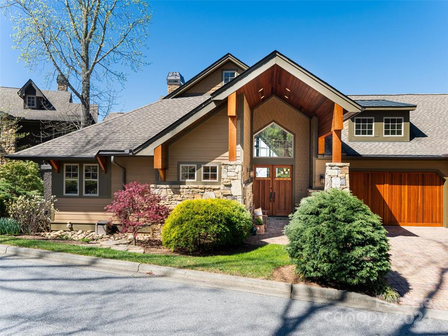 ACCEPTING BACK UP OFFERS!!!   VIEWS, VIEWS, VIEWS from this stunning Reynolds Mt. townhouse located on the highest elevation on a private-like street. Fiber optic service coming in 2024 ! 180 degree long range mountain views. One owner, MOVE-IN READY. Used as summer home only and in "like new" condition. Quiet-private like street with no drive-by traffic.  Cherry hardwood floors throughout main level.  Dedicated office/study/exercise room off kitchen with large window and sliding doors leading to deck. Kitchen and baths offer contemporary amber/gray/white granite countertops. Generac generator, two large decks for entertaining; lower deck is screened in and has entrance to and from the house allowing privacy for guests. 3 Bedrooms, 3 full baths, 1 half bath.  Main level living with Primary Bedroom on main level.