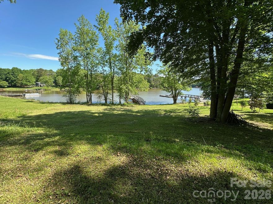 Well-priced ½-acre waterfront lot available on beautiful Lake Norman in the highly desirable Denver, NC area. With very few buildable waterfront lots remaining, this is a rare opportunity to secure your place on one of North Carolina’s most sought-after lakes.

This exceptional property features nearly 100 feet of shoreline, complete with an existing pier and floating dock, making it ready for immediate boating, kayaking, and lakeside enjoyment. A three-bedroom septic permit is already in place, and county water is available at the road, offering added convenience and cost savings for your build.

Thoughtfully designed home plans with a walkout basement are available for review, perfectly suited to maximize the gentle slope and capture stunning lake views. Whether you envision a full-time residence or a weekend retreat, this lot provides the ideal canvas.

The street is experiencing exciting growth, with several new construction projects and quality updates currently underway, further enhancing the appeal and long-term value of the area.

Enjoy the best of Lake Norman living — boating season, fishing, sunset views, and waterfront entertaining — all while being conveniently located just minutes from Hwy 150, shopping, dining, and everyday amenities.

Don’t miss this opportunity to build your custom lakefront home and start living the waterfront lifestyle you’ve been dreaming of.