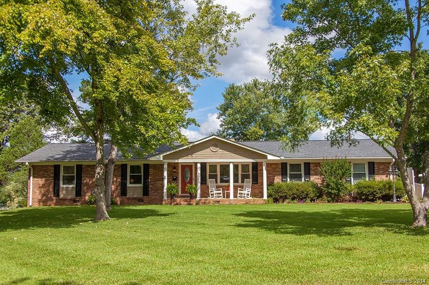 Charming 3 bedroom, 2 bath Brick home w Many New Updates. Recently installed Custom Cherry Cabinets, Granite in Kitchen, Stainless appliances, Dining Room with see through fireplace, Granite in Hall bath, Ceramic floors, Hardwoods, Whole house fan.  Seller has added a beautiful 11x22  Sunroom that over looks the Grecian style 14x28 pool- fenced in with also a wet bar/ bar height counter, cabinets, own outdoor Entertainment Area-Detached 20x40 garage-shop, wired 200 amp service of it's own