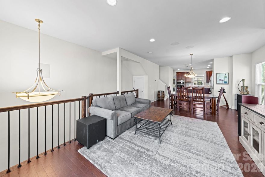 Now priced at $635,000 and offering a $5,000 credit toward closing costs with an acceptable offer, this end-unit townhome in gated South Village presents one of the strongest value opportunities in LoSo.

Built in 2019 and freshly painted throughout, this 3-bedroom, 3.5-bath home offers a purposeful four-level layout designed for flexibility and separation. Additional end-unit windows fill the home with natural light, while the open main level with hardwood floors creates seamless flow between kitchen, dining, and living spaces.

The kitchen anchors the home with generous prep space and easy entertaining layout, while upgraded wood stair treads add a clean, elevated finish throughout.

The fourth-floor flex level sets this home apart. With a solid wood door for added privacy, it functions beautifully as a home office, fitness studio, lounge, or guest retreat. Step directly onto the private rooftop terrace—an inviting outdoor space for relaxing evenings or hosting friends.

Additional features include wired surround sound with zone controls, a two-car tandem garage with epoxy flooring and extra storage, and direct access to a lower-level patio.

Located inside a gated community just steps from LoSo dining, breweries, the Rail Trail, and light rail—with quick access to Uptown—this home delivers end-unit privacy, flexible space, and walkability at a compelling price point.