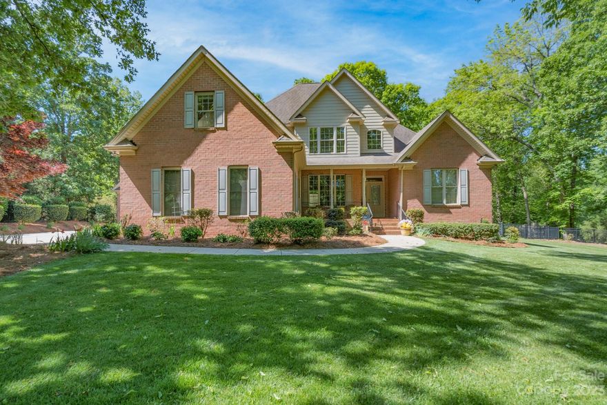 Wow, 3 car garage attached! With a large full brick 2 car detached garage, large enough to accommodate an auto lift.  Car enthusiast dream, with additional parking. Custom Full brick home on private lot 1. 5 acres.  Enjoy peaceful fenced in backyard.  This generously appointed home features a spacious kitchen, a huge great room with fireplace and beveled mirror above.  Primary suite on main with very spacious bathroom, and expansive closet system.  2 Bedrooms up, and a bath and bonus room, which can also flex as a bedroom.  Expansive hardwood floors, and rocking chair front porch.  Move in ready.  Bonus NO HOA.