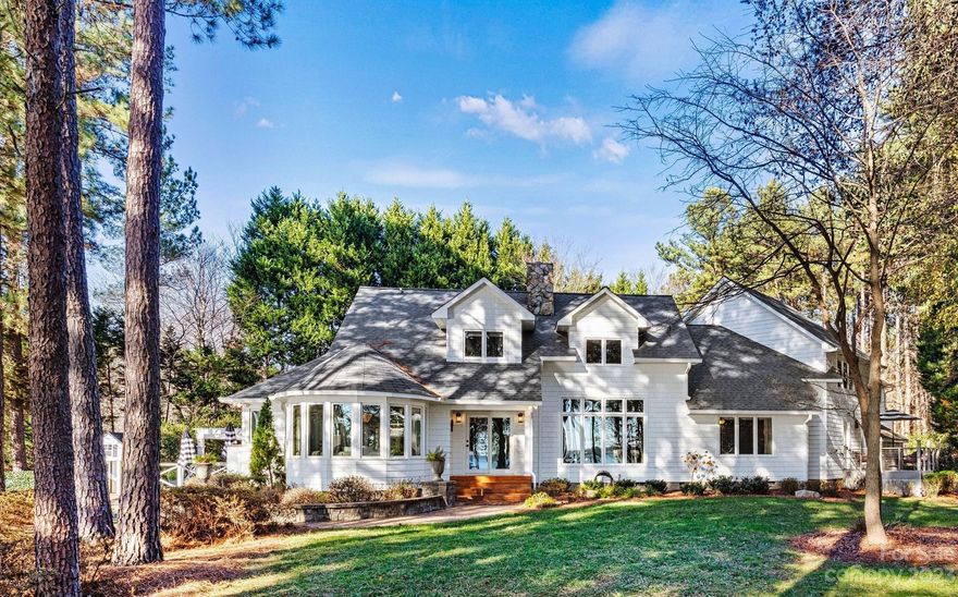 Your waterfront oasis is here! Step into the lap of luxury in this exquisite rare-find on Lake Norman. Situated on a 1.6+ acre peninsula lot just off of a main channel, you will see big water year-round. Not to mention waterfront views from almost every room in the house! Entertain in style in this freshly renovated home where timeless elegance meets daily comfort. As you enter, you are greeted by a gorgeous river rock fireplace ushering you into the living room with beautiful hardwoods, & you can watch picturesque sunsets over Lake Norman. The main level also hosts the owner's suite, outfitted for luxury with oversized walk-in closet and a spa like bathroom complete with lovely fireplace over the soaker tub. The dining room is fit for a feast, with room to seat a large gathering and also has a bay window overlooking tranquil waters. Upstairs you'll find an entertainment area, starlit ceiling, full bathroom w/ teak steam shower, & much more. Too many upgrades to list! A true must see.