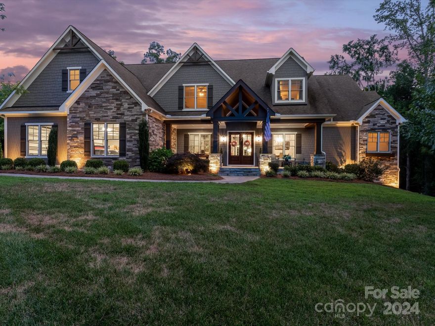 Welcome to your dream home in the prestigious Jacob's Ridge community! This elegant executive home, set on a sprawling 2.86-acre lot, epitomizes luxury and sophistication. Designed for seamless entertaining, the property features an amazing outdoor space: large back porch, heated saltwater pool with spa, sun shelf, and travertine pool deck. As you enter, the inviting front porch sets the stage for the grandeur inside. The great room impresses with a cathedral ceiling, while the open floorplan highlights a gourmet kitchen:large island, farmhouse sink, and walk-in pantry. The spacious primary bedroom provides a tranquil retreat. Guests will appreciate the main-level bedroom with an ensuite bath. The 2 upstairs bedrooms also feature ensuite baths. The large bonus room, complete with a wet bar, is perfect for entertaining. This home combines elegance and functionality, offering unparalleled entertaining options. Experience luxury living at its finest in this exceptional property.