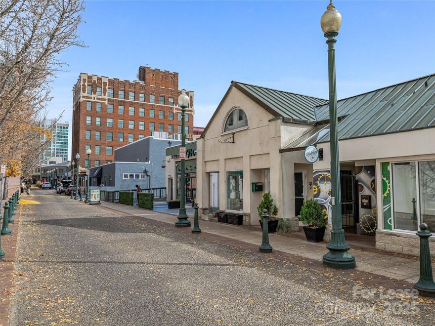 Exceptional downtown Asheville office opportunity on iconic Wall St. This 1,334 SF suite, offered at $28/SF Modified Gross, delivers a versatile layout ideal for professional office or showroom/office or retail users.  Accessible at street level on Wall St and through a corridor off Patton Ave. Just steps away from the Grove Arcade, next door to Spicer-Greene Jewelers and within walking distance of many restaurants, hotels, and businesses, including the Flat Iron, Luminoso, Early Girl Eatery, and Market Place.  Offering exceptional natural light and mountain views. Located in the heart of the CBD zoning district, the property offers excellent walkability and visibility, with approximately 19,000 vehicles passing nearby daily along Patton Avenue. Ample parking is available at the adjacent Wall Street parking garage. This location offers fast and convenient access to major highways, with distances of just 0.5 miles to I-240, 1 mile to I-26, and 1.5 miles to I-40. A rare chance to secure a well-located, flexible space in one of Asheville’s most dynamic commercial corridors.