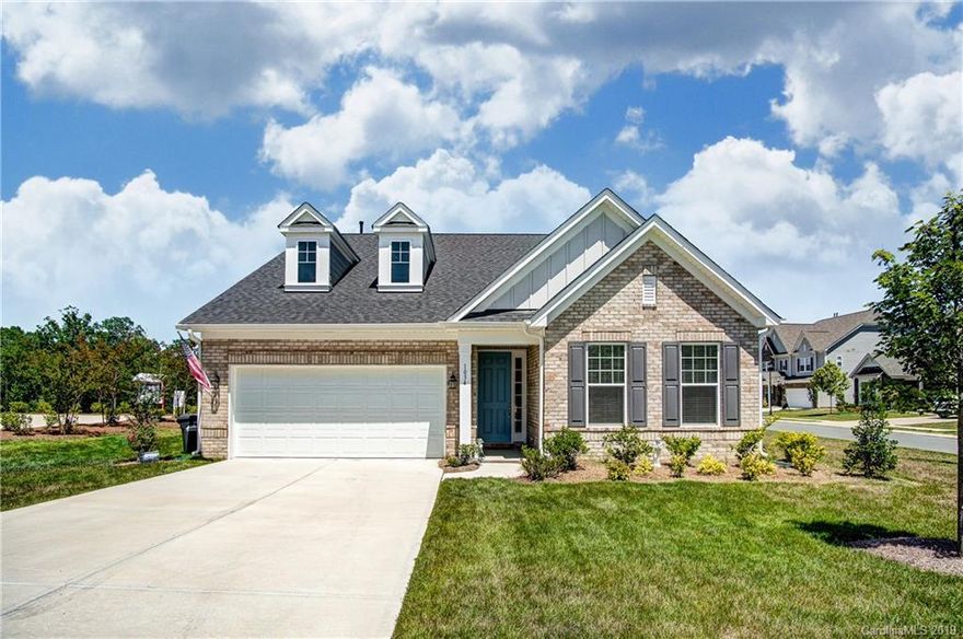 SIGNIFICANT PRICE IMPROVEMENT! Highly motivated seller! Pristine 1.5 story home in new development with tons of curb appeal! Upon entry, gleaming hardwoods and heavy molding. Incredibly bright open floor plan! Family room boast a gas log fireplace flanked by large windows for abundant natural light. Kitchen features gas cook top, SS appliance, island with sink, crisp white cabinetry, walk-in pantry, and breakfast bar. Sunny breakfast room leads to patio through sliding doors. Master bed with trey ceilings, and stunning master bath with massive mirror, his/hers sinks, and spacious walk-in shower. Laundry, two secondary bedrms, and additional bath on main. Upstairs, large loft area with additional bedroom and bath. Granite in kitchen and baths, G-Insulated windows, and covered patio off breakfast room. A can't miss home on a beautiful corner lot!