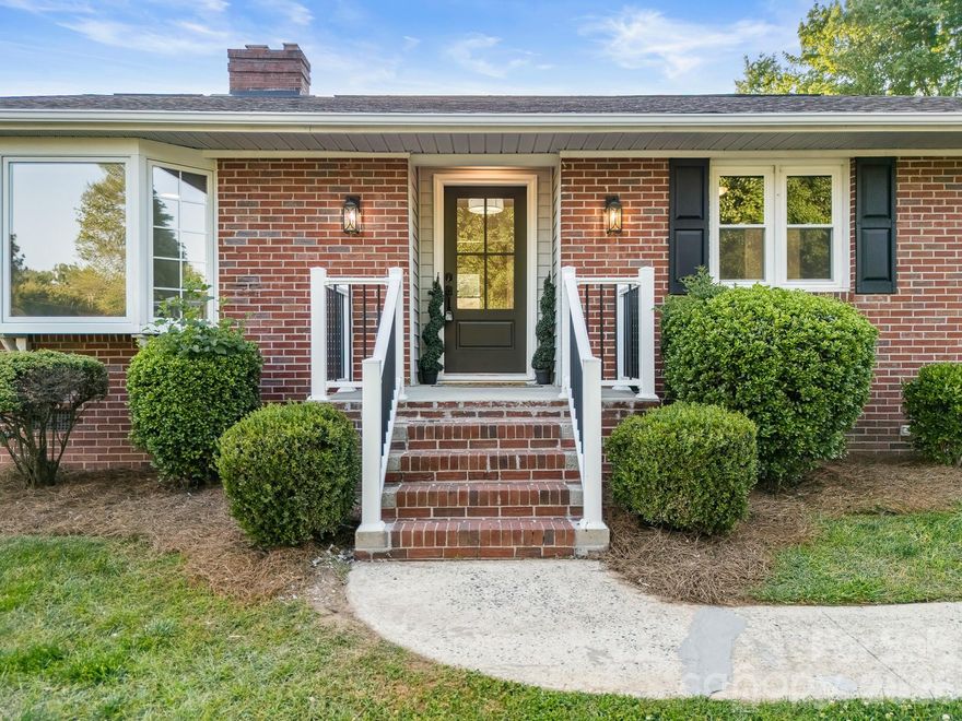 Better Than New | Fully Reimagined Living Near Downtown Rock Hill
Welcome to 1447 Sullivan Street—where timeless all-brick construction meets a complete, top-to-bottom transformation designed for today’s discerning buyer. Perfectly positioned on a spacious lot in an established neighborhood with no HOA, this home offers a rare blend of privacy, character, and convenience—just minutes from vibrant downtown Rock Hill and approximately 2 miles from I-77 for an easy commute.
From the moment you enter, the level of craftsmanship and detail is unmistakable. The home has been entirely reimagined, beginning with the removal of original paneling and replacement with fresh sheetrock, creating a clean, modern aesthetic throughout. Richly stained hardwood flooring flows seamlessly through the main living areas and bedrooms, adding warmth and sophistication, while designer tile elevates each bathroom space.
The primary suite delivers a true retreat experience, featuring a custom tiled shower with upscale finishes that rival those found in much higher price points. Bathrooms have been thoughtfully redesigned with new vanities, updated plumbing fixtures, modern lighting, and elevated hardware selections.
At the heart of the home, the kitchen is a standout showpiece. Completely rebuilt with new cabinetry, stunning quartz countertops, a stylish subway tile backsplash, and sleek black hardware, it pairs beauty with functionality. Recessed lighting and stainless steel appliances complete the space, making it ideal for both everyday living and entertaining. Just beyond, a dedicated bar area with a built-in wine cooler creates the perfect setting for hosting and gathering.
Additional living space is found in the sunroom/mudroom, offering flexibility for a home office, lounge, or drop zone, complete with convenient laundry access. Outside, a covered rear carport adds practicality while maintaining the home’s clean and cohesive design.
Behind the walls, no detail has been overlooked. This home features all new plumbing—both inside and underneath—as well as updated electrical systems, all new windows, and a new on-demand water heater for modern efficiency and peace of mind. New interior doors, hinges, and hardware further enhance the home’s cohesive design.
This is not simply a renovation—it’s a complete reinvention. A rare opportunity to own a thoughtfully upgraded, move-in ready home with refined finishes, classic construction, and a location that places you close to everything Rock Hill has to offer.
Schedule your private showing and experience the difference for yourself.