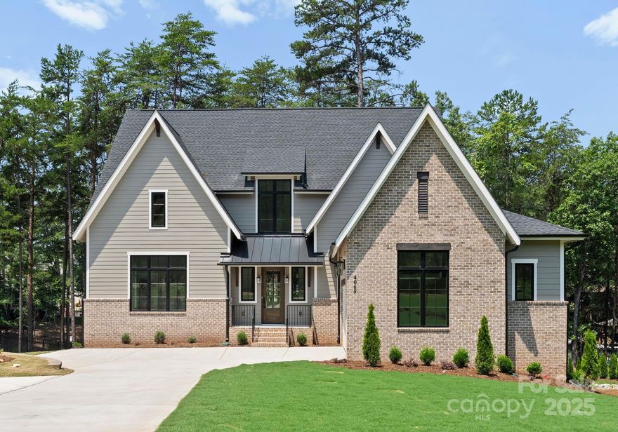 Luxury Waterfront Living on Lake Norman – Move-In Ready & Packed with Upgrades! Welcome to 4069 Rivendell Road—a stunning Modern Tudor Farmhouse on a quiet cove, just minutes from open water.  Step inside and enjoy vaulted ceilings with wood beams, a gourmet kitchen with premium luxury appliances, and designer finishes throughout. With 5 spacious bedrooms, a private office, and a fully finished walk-out basement with a wet bar and recreation space, there's room for everyone. The primary suite on the main floor offers spa-like tranquility, and upstairs features 10’ ceilings! The fully finished walk-out basement includes a wet bar and rec space—perfect for entertaining. Outside, professional landscaping, irrigation, and your personal private floating dock to create a complete lakefront experience. Built by Lagniappe Homes to exceptional standards and priced below similar new waterfront homes. No long wait—this stunning property is ready now for its first owner!