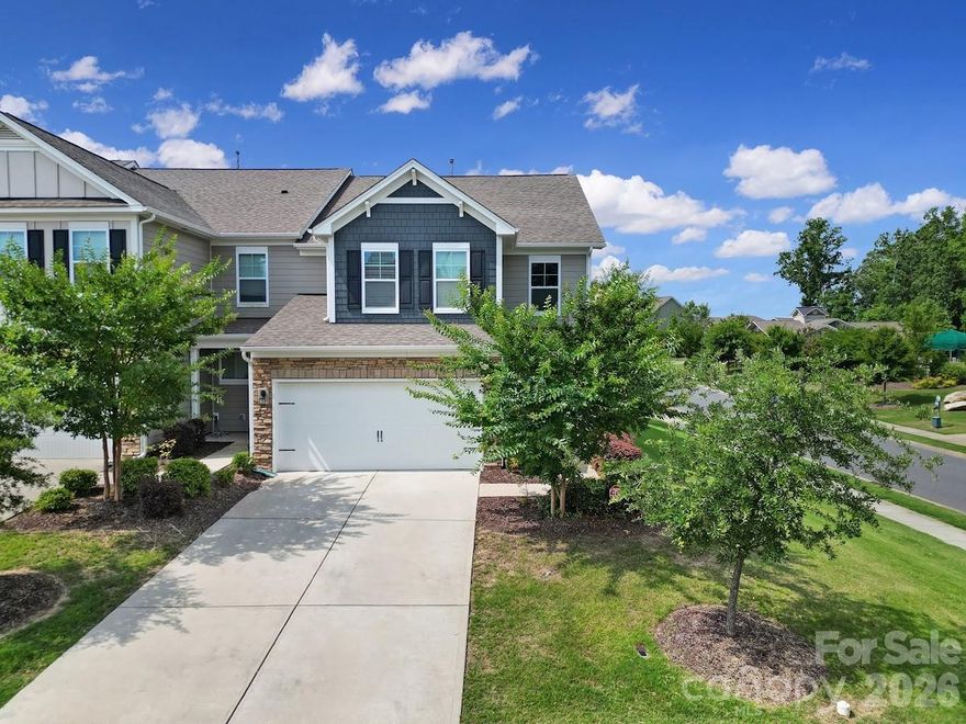 It is a model home end-unit—one of the largest townhomes you’ll find! This home features an open floor plan with beautiful wood flooring throughout the main level, crown molding, and a neutral color palette that creates a warm, inviting feel. Additional highlights include wood faux blinds, brushed nickel fixtures, and tile flooring in all wet areas.

The stunning kitchen showcases gorgeous granite countertops, Kona staggered cabinetry, a classic white subway tile backsplash, and matching stainless steel Frigidaire appliances—including a gas range, refrigerator, dishwasher, and microwave. The oversized island serves as the centerpiece, complete with pendant lighting and seating for four—perfect for entertaining.

The main-floor owner’s suite offers convenience and comfort, while abundant windows throughout the home provide excellent natural light.

Upstairs, you’ll find generous bedroom space, an additional living area, and plenty of storage.

Enjoy being within walking distance to the neighborhood pool and just minutes from restaurants, shopping, and major highways—making this an ideal location.