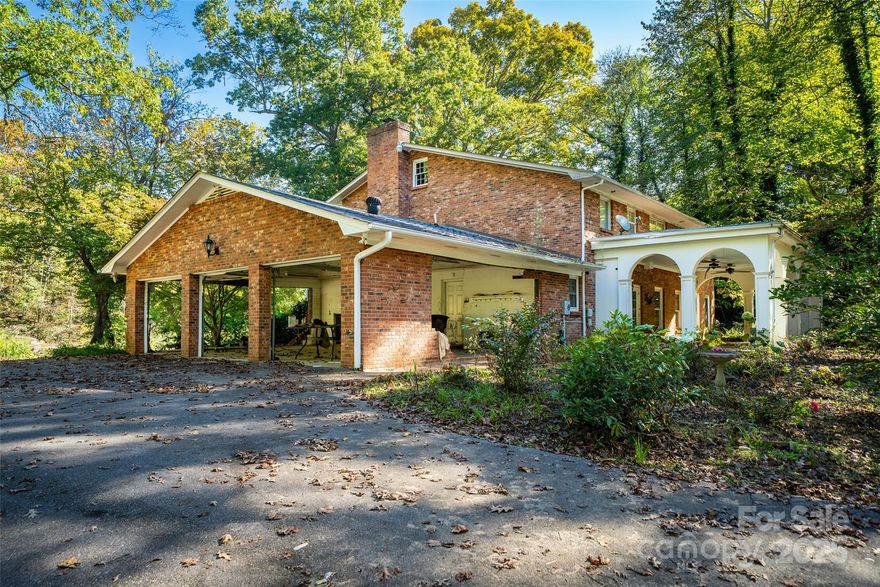 This historical home was hit by the flooding from Hurricane Helene yet has so much to offer with 1.1 acres and all the river access you can imagine! With a beautiful location right on the Pigeon River you have kayaking and fly fishing right out your back door. Just a 1 mile walk into town you have the feel of country living just minutes aways from all the amenities Canton has to offer. A short 25 minute drive and you will find yourself with all the amenities Asheville has to offer with its bustling food and beverage scene and easy access to the Asheville Airport. So much potential as you get to design how you want your home to look and feel. Maybe don't rebuild, instead turn this property into a water sport complex for your next business venture. Think of the possibilities when you buy both 21 & 61 Riverbend Rd!