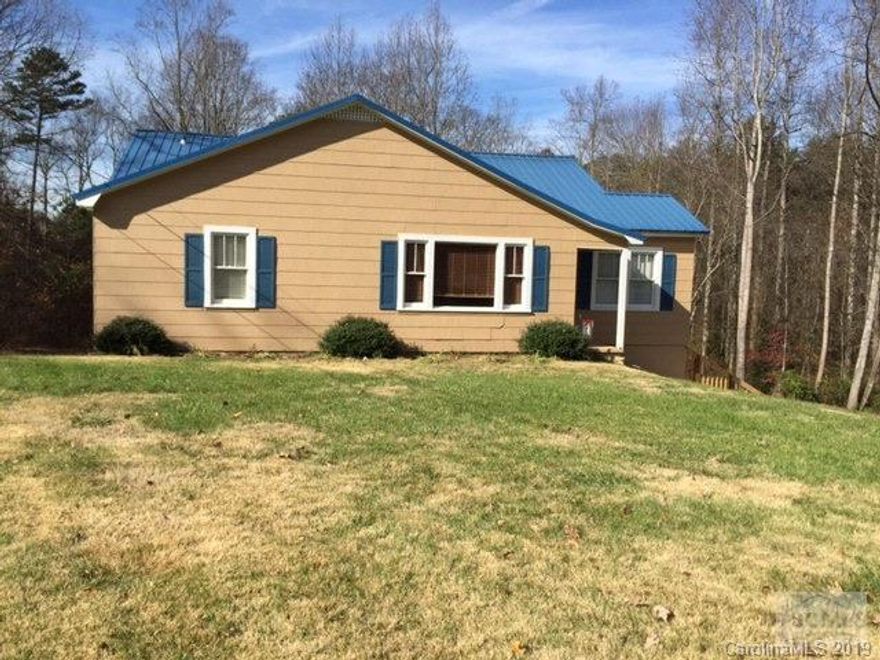 Great home in an even better location, less than 5 mins from interstate. New exterior paint. Hardwoods in living room and all bedrooms. eat-in kitchen w/ plenty of cabinet space. New metal roof in 2010. Full unfinished basement w/ 2 car garage pull in and plenty of storage space. Great back yard boarded by small stream. Lg. master bedroom. Spacious bathroom with walk-in closet.