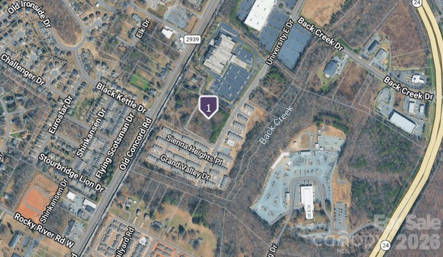University East & Old Concord | ±2.849-Acre Development Opportunity
Charlotte, North Carolina

Located at the intersection of University East Drive and Old Concord Road, this ±2.849-acre site presents a compelling development opportunity in one of Charlotte’s most active growth corridors—University City.

Positioned just off W.T. Harris Boulevard, a major east–west arterial, the property benefits from strong connectivity, high visibility, and immediate access to the broader North Charlotte market. The surrounding area features a diverse mix of uses, including attached single-family residential, multifamily communities, retail centers, hospitality, medical office, and established suburban office parks—creating a well-rounded live-work-play environment.

The site offers meaningful optionality for developers, with the ability to accommodate a range of product types including:

Multifamily or build-to-rent residential
Townhome or attached single-family
Mixed-use or neighborhood-serving retail
Medical or professional office
University City continues to see significant momentum driven by:

Ongoing expansion and investment at University of North Carolina at Charlotte
Strong job growth across North Charlotte, including major employers like Albemarle Corporation and Eli Lilly and Company
Continued residential and retail development supporting population growth and demand
With its strategic location, surrounding density, and proximity to employment and institutional anchors, University East & Old Concord represents a well-positioned infill development opportunity within a rapidly evolving submarket.
