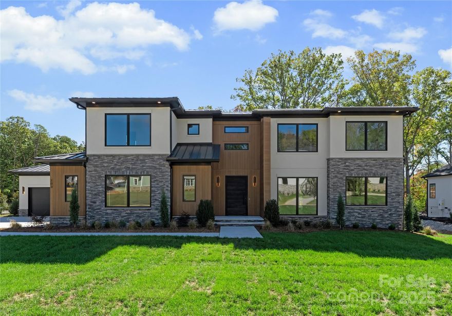 Experience Modern Luxury in a relaxed, suburban setting here at 203 Sugar Maple Dr, in popular Twin Lakes. Custom built and completed in October 2025, this home is designed for contemporary living with ultimate comfort and style. The interior design of Sugar Maple complements the unique exterior, with a palette of neutral hues and diverse textures to create a one of a kind masterpiece. A two story great room features an open floor plan and an abundance of windows that flood the first floor with natural light allowing every detail to truly shine. A gourmet kitchen designed for culinary enthusiasts, featuring a spacious island, high-end Wolf appliances, large butler's pantry and a luxurious Sub-Zero wine refrigerator. Don't miss the sauna tucked away on the main floor, complete with a SaunaLogic smart sauna control system. On the second floor, the primary bedroom serves as a serene oasis, featuring a convenient morning bar, flex space, en-suite bathroom with garden tub, walk in shower and an expansive closet designed for optimum organization. Cook your steaks, light a fire, relax and enjoy a Carolina evening on your screened back porch. Limitless design potential in the back yard invites you to create your own personal sanctuary. Located in Union county, close to zoned schools, Waverly/Blakeney shopping centers and quick access to 485. Come take a look and make this extraordinary work of art yours today!!