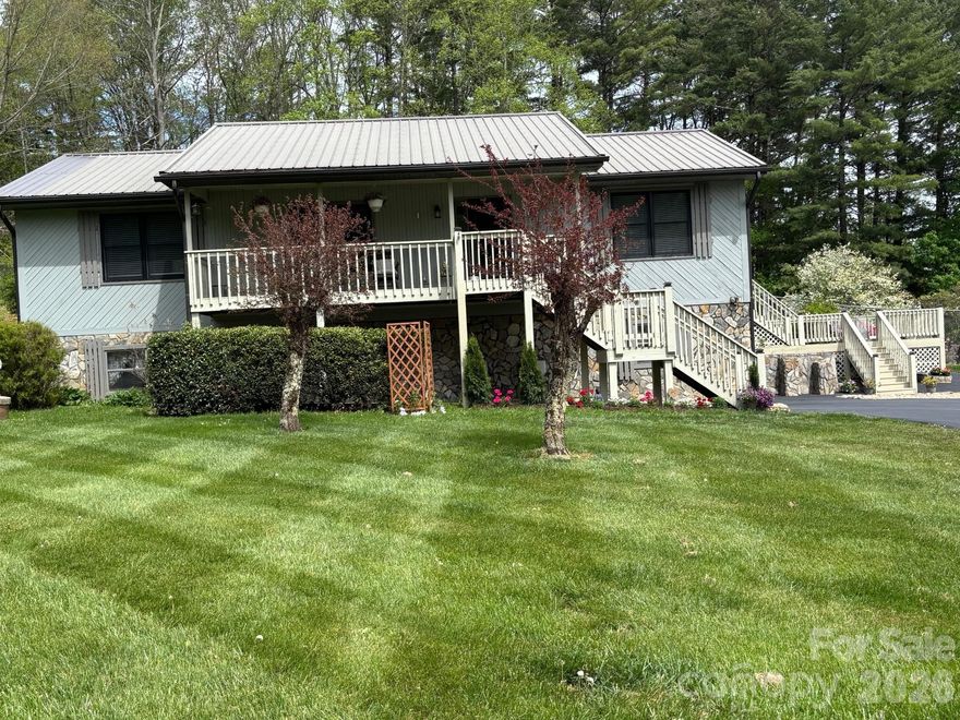 MOTIVATED SELLERS FOR COMPLETELY REMODELED HOME in highly desirable town of Burnsville, NC.  THIS PROPERTY WAS NOT AFFECTED BY HURRICANE HELENE IN ANY WAY.  Enter by Front Porch or thru Garage.  Never worry about too many stairs to climb as this meticulous home has a Full Sized Polluck Lift Elevator in the basement & opens up to the Living Room area.  Enjoy Open Concept living in this Turn-Key home.  Kitchen features Cherry wood cabinets, Granite countertops & Stainless Steel appliances.  Family Room is cozy & inviting with knotty pine walls, cathedral ceiling & electric Fireplace.  Mountain views can be seen from Front Porch & every window, including views of Mt. Mitchell from the back Deck.  UPGRADES INCLUDE:  All new windows throughout, Full Sized Elevator, Wood flooring, entire Kitchen, both Bathrooms, Interior/Exterior doors, 4 Ton Heat Pump, Washer/Dryer, Crown molding, fresh paint Interior/Exterior, window Treatments, new lighting Fixtures & Fans, automatic Garage Door, new Gutters,  remodeled Gazebo, Asphalt driveway & electric Gate, all new electrical wiring & plumbing thru-out home.
This Raised Ranch home is situated just a few minutes from Town for easy access to shopping, eclectic eats, unique boutiques, arts & crafts, horseback riding on a 20 mile trail, fly fishing & hiking to the Roaring Fork Falls.  Visit the Dark Sky Observatory for a memorable experience, along with golfing at the Mt. Mitchell Golf Club.  Enjoy small town charm & fresh mountain air at this gateway to Mt. Mitchell.  Town offers seasonal festivals to enjoy local foods, music, local Artisans & Galleries.  Book a Showing of this fantastic home today, you will NOT be disappointed.