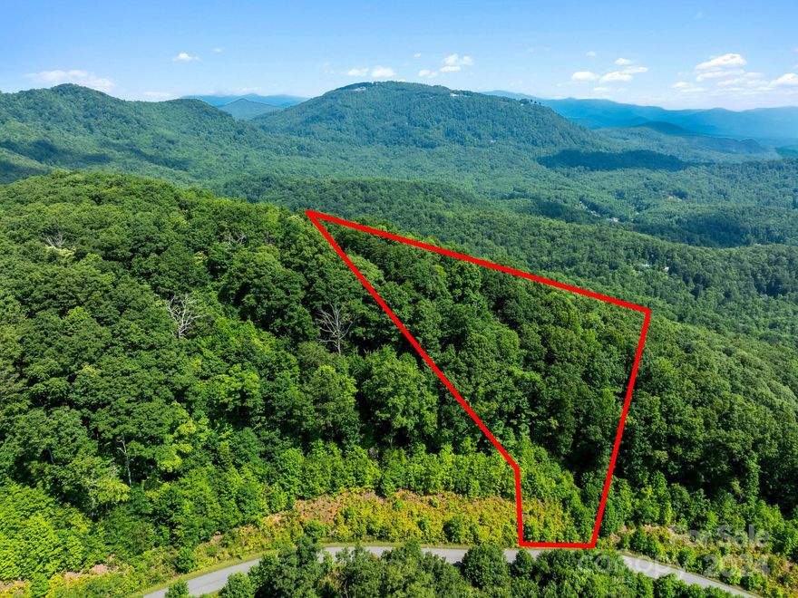 MAJOR VIEW POTENTIAL with an engineered driveway and a home at the top of this lot with 180 degrees. Grey Rock is one of Lake Lure’s best kept secrets! With sweeping views, beautiful old growth forests, numerous creeks/waterfalls, and approved plans to add miles of hiking trails, now is the perfect time to acquire your buildable lot in this up-and-coming gated community. This gorgeous hideaway is just minutes north of the shores of Lake Lure with paved roads, high-speed fiber-optic cable and internet, and extremely low HOA dues. Grey Rock Community Association is surrounded with conservancy land and endless vistas of the Blue Ridge Mountains.