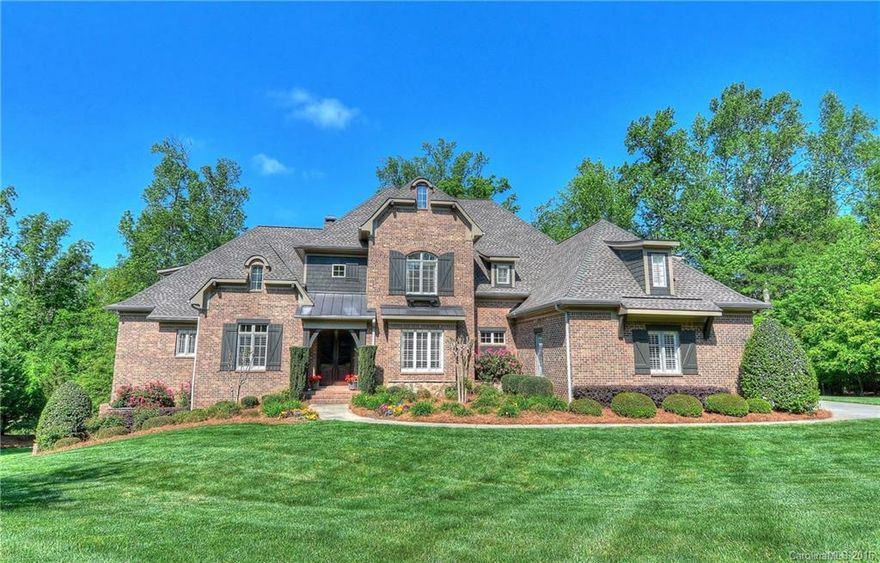 Elegant floor plan features beautiful hardwoods, custom moldings, plantation shutters & surround sound.Gorgeous gourmet kitchen opens to a 2-story great room w/fireplace.A cathedral ceiling & luxury bath highlight the main level owners retreat.Main level guest suite & large bedroom suites that open to a bonus room upstairs.Finished lower level offers a family rec space & secondary living expansion.A screened porch w/fireplace & flagstone terrace overlook wooded privacy & the 13th tee & fairway.