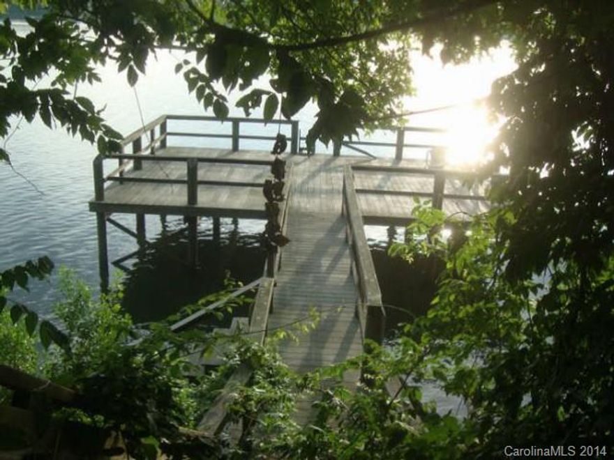 Excellent waterfront property. Home is in very poor condition - unsafe to enter and has no value. Wood dock to water is in average condition. Home is being sold "as is" and seller will make no repairs or representation to the home. Wonderful opportunity to own lakefront property and build a new home!