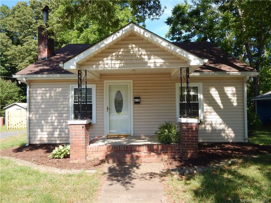 Cute as a button!  Snatch it up before it's gone!  Move-in ready with beautiful hardwood floors throughout, updated kitchen and bath, freshly painted walls, and new light fixtures and hardware.  This home also has a large fenced back yard and adorable front porch.