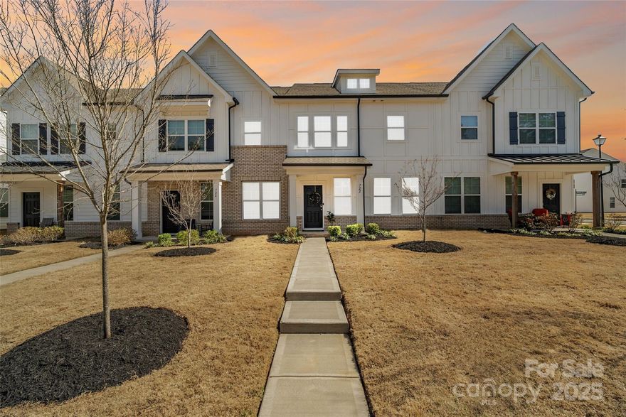 Welcome to this gorgeous, better-than-new townhouse! When you step into this 3 bed/3 bath home, you will notice the natural sunlight and neutral tones throughout. The open floor plan boasts of a large kitchen and kitchen island, a dining area, a living area, and a half bath on the main floor. On the upper level, you will discover the primary suite, thoughtfully designed with top-of-the-line modern features such as a luxurious walk-in shower and spacious walk-in closet.You will also find 2 other large guest rooms, a guest bath, and laundry room upstairs. The best part of this perfect home? You are walking distance from local shopping and dining and conveniently located near the heart of Rock Hill and I77!