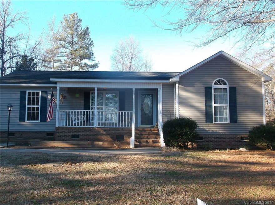 Welcome home to your immaculately kept, darling ranch style house in the country with 2 large BR/2 BA.  Master features built in linen closet & spacious walk in closet.  Relax by the fireplace in the open & cozy family room.  French doors lead to the deck overlooking the backyard, including a fenced area–great for pets. Storage galore w/ 2 sheds & bonus work area! The swing on the covered, front porch is the perfect oasis for sipping sweat tea, enjoying the quietness of a dead end street.