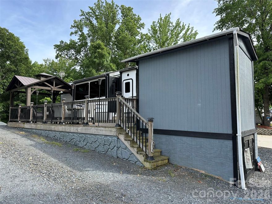 Come experience lake life at its best with this beautifully maintained 2022 Avalanche by Keystone 5th wheel camper located in the gated waterfront community of Badin Shores Resort. This spacious retreat features 2 private bedrooms (king & queen) plus a loft, 2 full bathrooms, stainless steel appliances, high ceilings, abundant natural light, and exceptional storage throughout. Step outside to enjoy the expansive full-length deck complete with a shaded gazebo — perfect for entertaining, relaxing, or enjoying peaceful evenings after a day on the lake. Conveniently situated between the marina/boat ramp area and the community swimming pool, putt-putt golf, basketball courts, playgrounds, and more, all resort amenities are just a short golf cart ride away.
 Whether you’re searching for a weekend getaway, vacation retreat, or your own slice of lake paradise, this property offers comfort, convenience, and resort-style living all in one.
