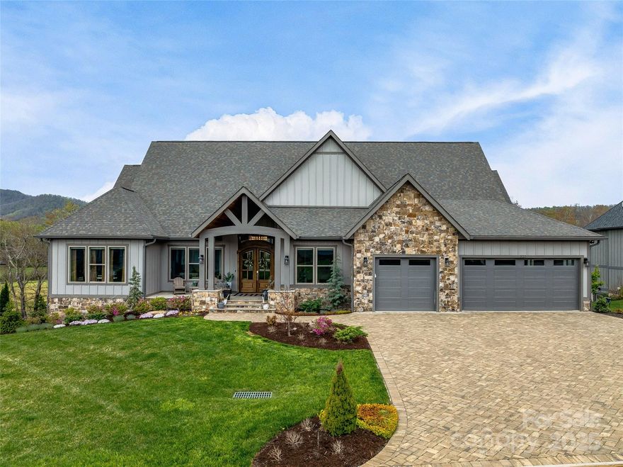 Welcome to 325 Daniel Circle Dr where contemporary meets luxury. As you step inside, you’re greeted by an expansive open floor plan that seamlessly connects the living, dining, and kitchen areas. Soaring ceilings and large windows flood the space with natural light, complemented with a wood paneled accent wall and custom office space. The kitchen is a masterpiece, featuring high-end appliances & countertops, and custom cabinetry, perfect for both culinary adventures and casual entertaining. The back deck offers a second fireplace, built in grill, and is fully screened in. Being one of the few homes in the neighborhood that has both interior stairs and exterior access to the oversized basement, this home is a rare opportunity! The basement boasts high ceilings with an additional 3,200+ square feet of unfinished space, perfect for a home gym, golf simulator, tons of extra storage space, or whatever you may desire. 14 minutes to Asheville airport, 33 minutes to Downtown Asheville.