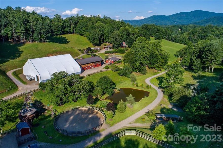 Nestled in the Appalachian Mountains, this farm is home to an inherent stillness rarely found in today's busy world. Careful attention to detail went into every aspect of the development of this 112-acre property, as evidenced by the solid, energy efficient buildings, professionally excavated & maintained roads, trails & paths. There are numerous sites for future development of a larger home, cabins or tiny homes. Located a short 10 minutes from downtown Burnsville, a true small town with grocery stores, locally owned shops & restaurants.  Clearly, the standard in planning & developing this land is quality. The home is perfect for those who value the environment, comfort, & sustainability. The meeting building is located near the multi-use barn & 100x100 covered arena, all overlooking the spring fed pond. This grouping is efficient and provides a large excavated flat area which is valuable in this area. These buildings can be easily converted for large event, wedding, or retreat use.