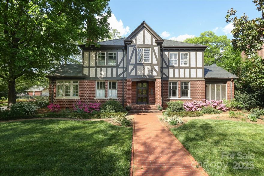 This classic English Tudor sits on a picturesque street in historic Dilworth. Built in 1926 by the Hart family, it occupies a prominent corner lot in the heart of the neighborhood. With 4 bedrooms and 3 and a half baths, the home features high ceilings, spacious living areas, and abundant natural light. The newly remodeled kitchen is a chef’s dream—ideal for cooking and entertaining. Additional first-floor highlights include generous living and dining rooms, a cozy den, home office, laundry/craft room, sunroom, and a quintessential Dilworth screened porch. A light-filled staircase leads to a spacious landing with built-ins—great for reading or play. Upstairs includes a large primary suite, two more bedrooms, and a shared bath. Mature landscaping surrounds the home, with inviting outdoor spaces and walkability to South End, Uptown, and Midtown. 801 Berkeley Ave. blends historic charm with modern comfort.