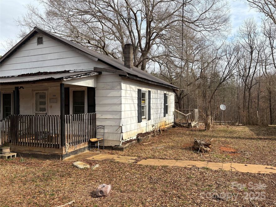 Nearly 2 acres of unrestricted land featuring a barn and a house. The 2-bedroom home requires some TLC, but the potential is limitless!