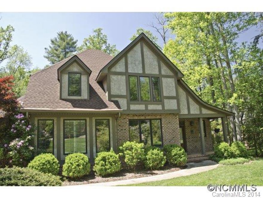 Spacious modern tudor on wonderful large lot in most established area of Biltmore Park. Surrounded by mature landscaping, this luxury home is nestled on a large lot adjoining a quiet park & connected to the trail system. 5 bedrooms & 4 baths on 3 nicely finished levels. Great room with cathedral ceiling & gas fireplace opens onto screened porch overlooking the private, fenced yard. Terrace level play room, family room with wet bar & guest room.