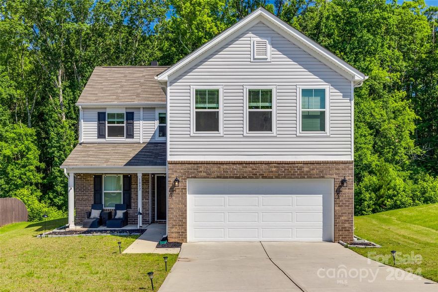 This like-new home, built in 2021 is move-in ready! Downstairs features an open floorplan with home office.  Living room has a fantastically framed wood-burning fireplace, and spacious eat-in kitchen with upgrades from the tile backsplash to the granite countertops. Upstairs you will find a spacious loft. Sizable bedrooms boast plenty of storage space, especially the primary suite with TWO walk-in closets. Additional home features include massive driveway and two car garage with plenty of room for additional storage. Bask in the peace of your back patio with wooded views. Come check out this beauty today! ELIGIBLE FOR UP TO $7500 IN LENDER CREDITS FOR QUALIFIED BUYERS THAT ELECT TO USE PREFERRED LENDER!