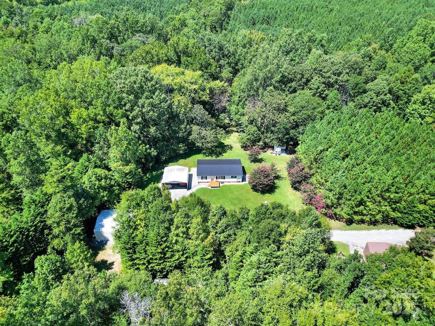 Beautiful property with privacy on 3 Acres at the end of a private road with a gate.  Immaculate 3 Bedroom 2 Bath Home with 2 - 2 car carports, 2 storage buildings, 2 creeks, and a new deck on the front.  Also on the 3 acres is an additional well & septic, and power already in place for a 2nd home site, shop or in-law suite.  The home has vaulted ceilings, ss appliances, and comes completed furnished.  A must see!