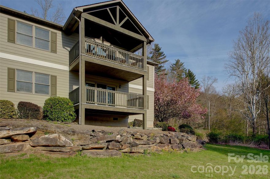 Need a MODERN place in the MOUNTAINS on the INEXPENSIVE side? Need BREATHTAKING VIEWS at a VALUE? 
Need Paved Road, Drive, Parking and EASY LOWER LEVEL ENTRY? LOOK NO FURTHER!  We are pleased to present a rare opportunity to own a Fairway Villa Condominium at the former Mt. Mitchell Golf Course. This fully furnished ground level home is a corner unit that has views that will never quit!  Featuring 2-bedrooms, 2-Baths, easy open split bedroom floor plan with laundry on the main, and a view/entertainment deck that will be the center of activity for family and guests.  There is a cozy gas log unit that will keep you toasty on those colder nights, and central air for the rare humid days of heat here in paradise.    
Mt. Mitchell and the Burnsville area are approximately mid-way between New York and Florida, and is easily one days drive from 60% of the entire US population— New York, Philadelphia, Washington D.C., New England, Florida and the Mid-west.
No matter the road you take, to or from here, it’s always the “scenic route!”
You are just 20 minutes away from downtown Burnsville, downtown Little Switzerland; 5 minutes to the Blue Ridge Parkway; 35 minutes aways from the famous Penland School of Crafts; 50 minutes to Asheville, NC; This condominium is two and a half hours from Charlotte, NC.