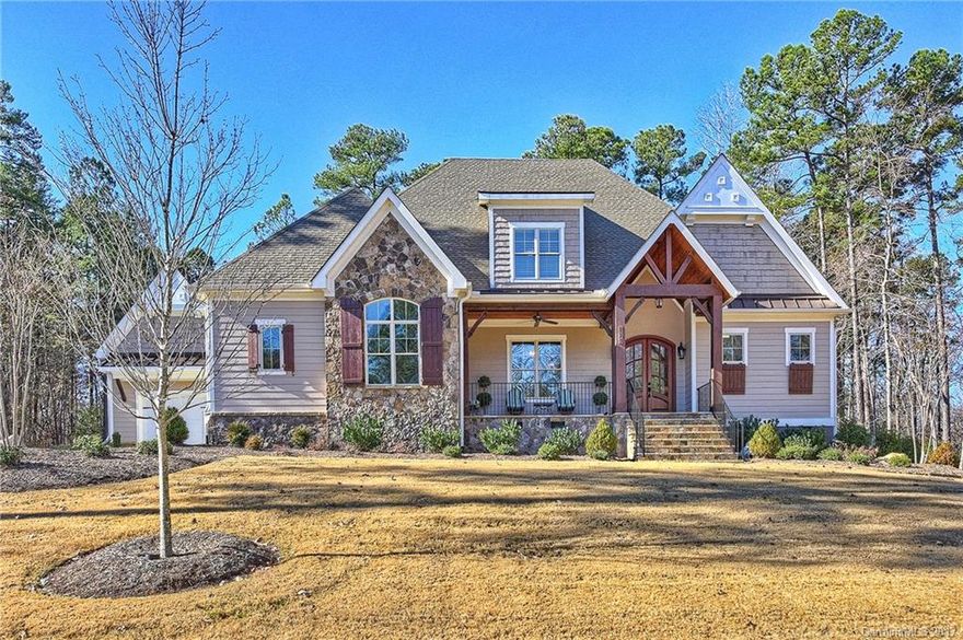 This stunning ES Johnson custom craftsman is like new with wonderful open floor plan, thoughtful upgrades and highly desired main level living. Spectacular kitchen with large center island, great room with coffered ceilings leads to grand timber framed screened porch w/ outdoor kitchen and 2nd fireplace for year round entertaining. Master retreat plus two BR on main level. Upper level boasts large bonus room plus 4th BR suite, walk in storage. 3 car garage and deeded boat slip around the corner!