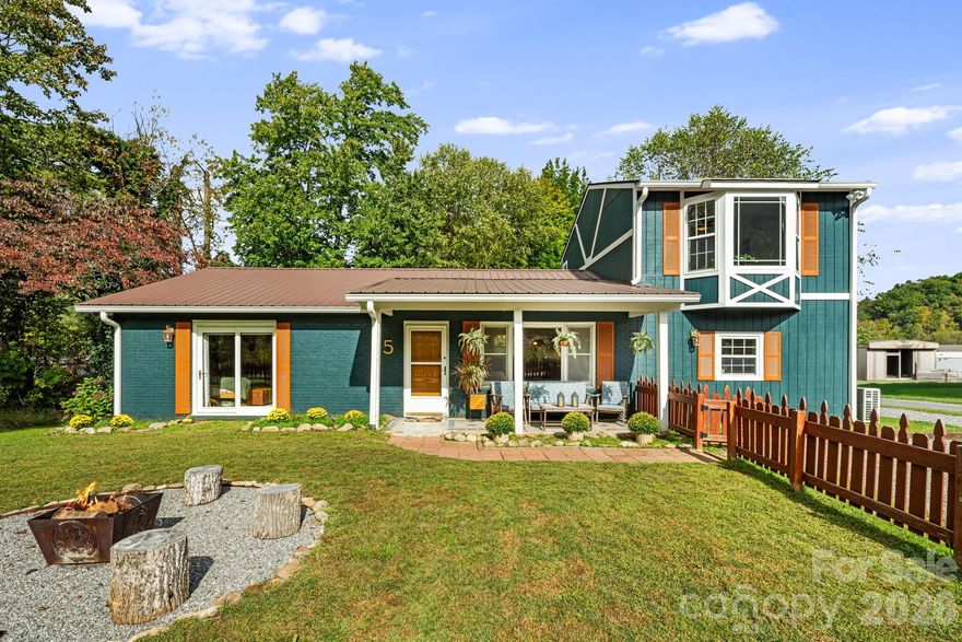 Experience the ideal balance of mountain tranquility and everyday convenience in this beautiful 3-bedroom, 2-bath home in Waynesville. Nestled in a peaceful country setting, this property offers privacy—yet remains just minutes from local shops, dining, and amenities.

Take in stunning, close-range mountain and pasture views from the porch and unwind to the calming sounds of the creek bordering the property—your own slice of mountain living. Inside, flexible living options include a separate 1-bedroom living quarters, perfect for rental income, guest accommodations, or multigenerational living.

Recent updates throughout the home add both comfort and value, including a newer HVAC system with mini-splits, updated flooring, added cabinetry and storage, an encapsulated crawl space with dehumidifier and sump pump, and new gutters with guards. Be sure to request the full list of improvements.

Additional outbuildings provide ample storage, and the serene setting makes this property a rare find. Whether you're searching for a full-time residence, an investment opportunity, or a private mountain retreat, this Waynesville property delivers.