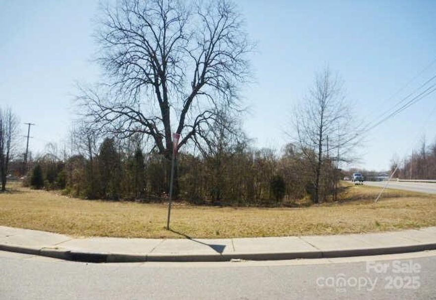 Exceptional corner lot located at E. Long Avenue and N. Poplar Street. This 1.52-acre property is ideally situated just half a mile from I-85 and one mile from the thriving FUSE District, offering high visibility and convenient access.

Zoned IU (Urban Industrial), the site supports a wide range of development possibilities, from residential to commercial projects. Engineering plans for 16 patio homes have already been approved by the City of Gastonia, streamlining your path to development.

Located in a designated Opportunity Zone, this property presents a unique investment opportunity with potential tax advantages. Don’t miss out on this versatile and strategically located parcel ready for your next project.